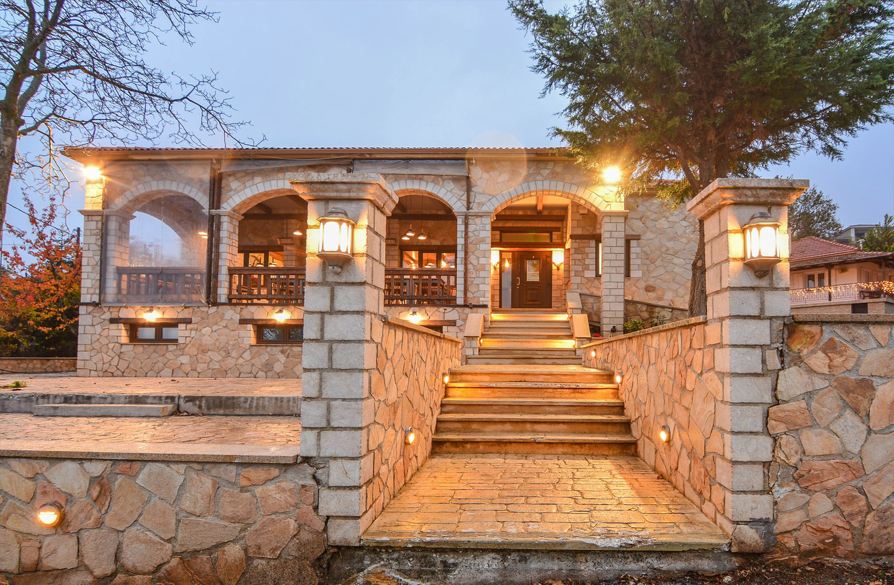 Stone exterior of Oti Kalo Restaurant in Trikala Korinthias, Greece