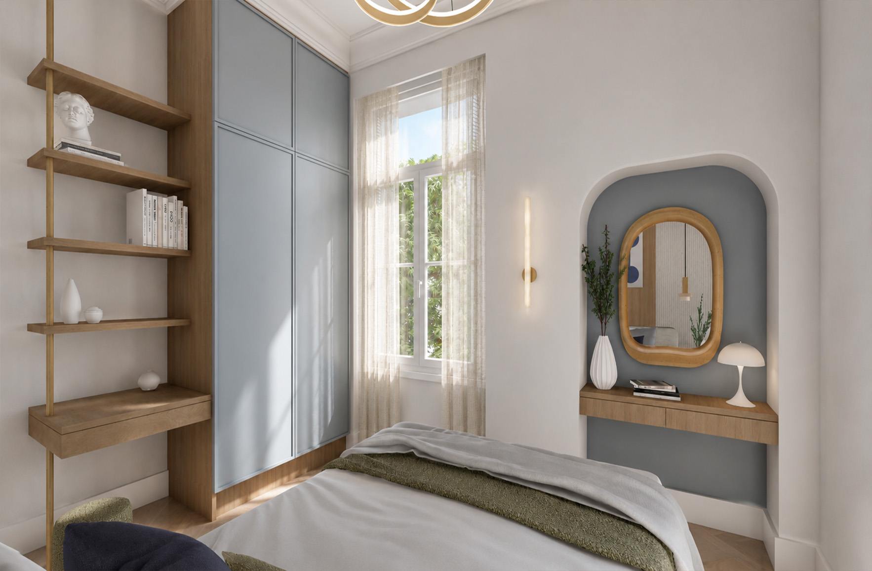 Bright bedroom with blue-grey fitted wardrobes, timber shelving and a vanity integrated into an arched wall niche.
