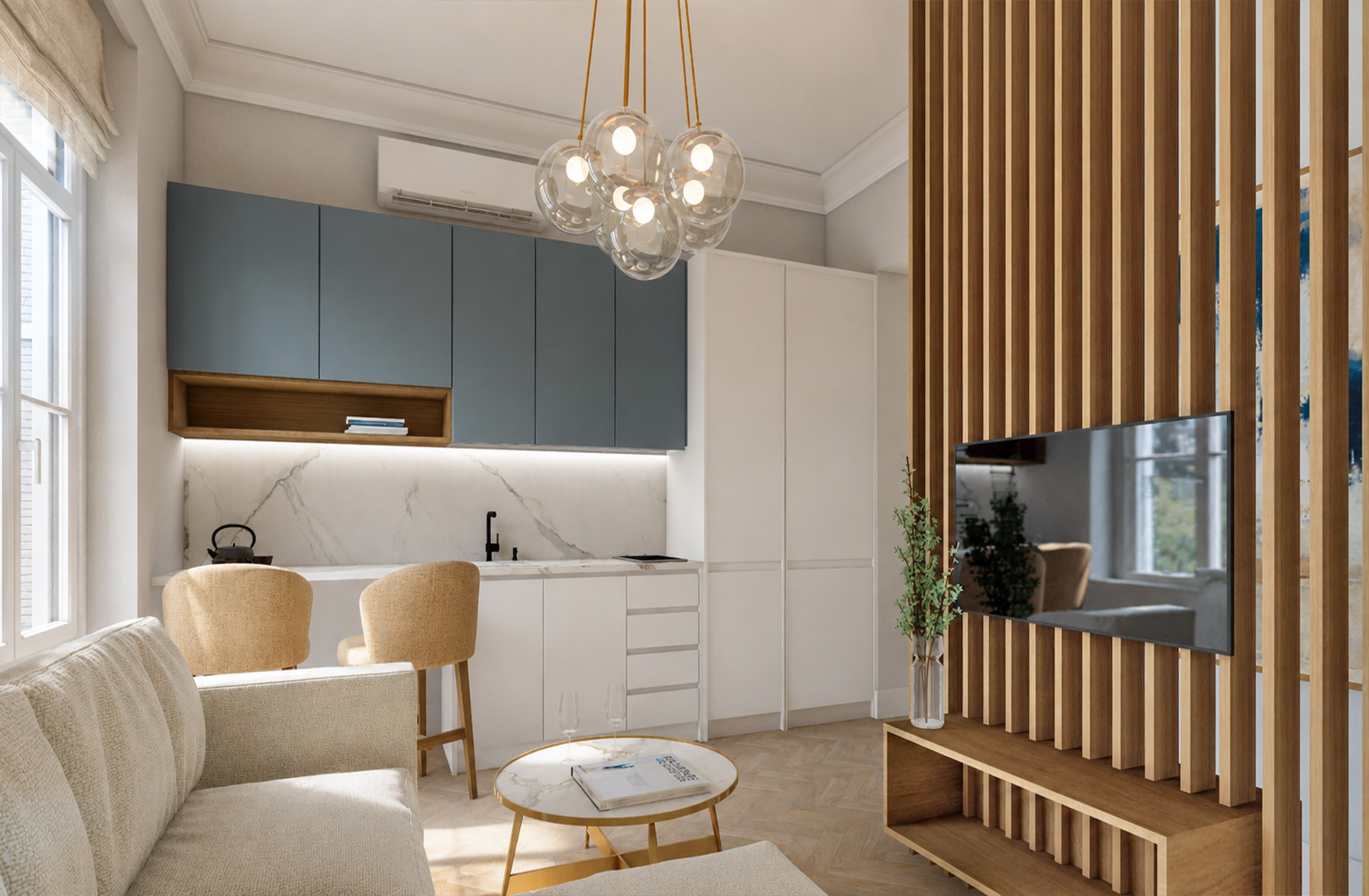 Bright living room with a compact kitchen, blue-grey cabinetry and a television integrated into a timber slatted divider.