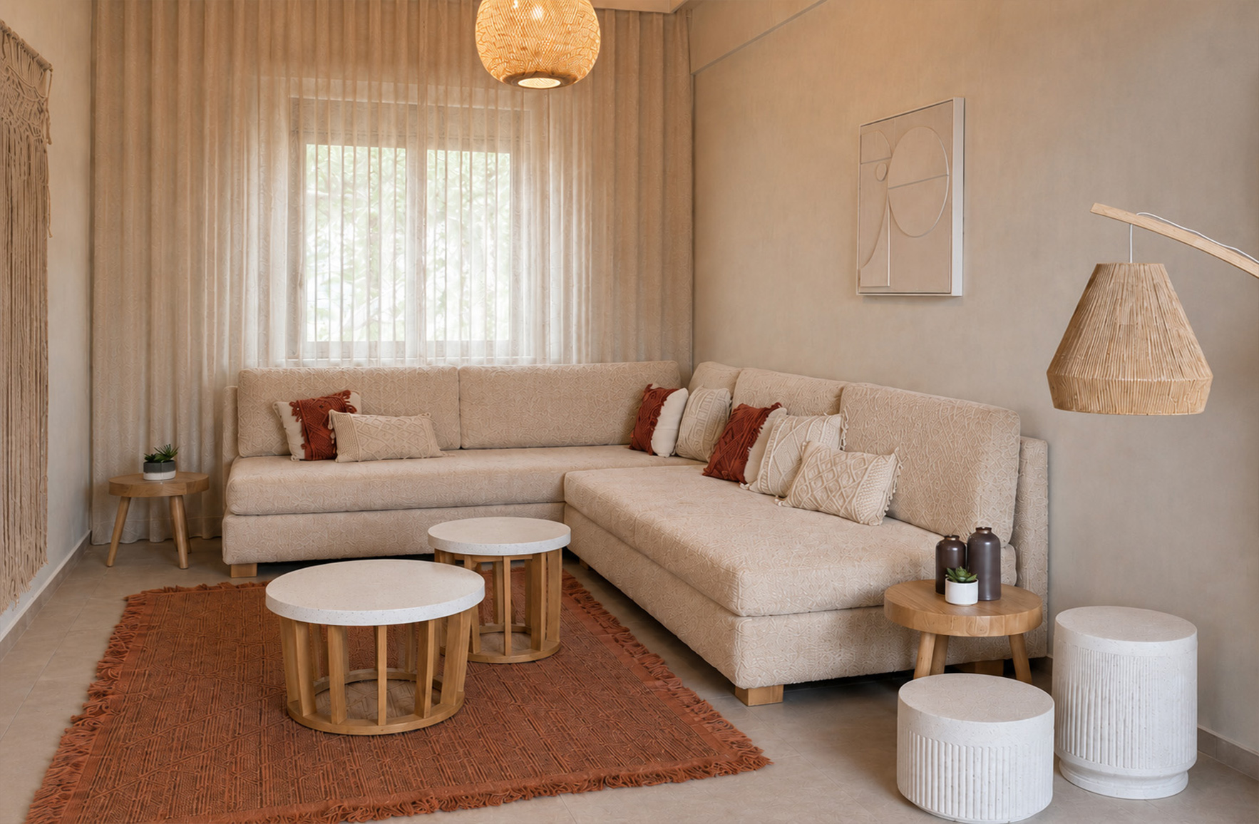 Neutral living room with a corner sofa, terracotta rug, woven lighting and natural wood tables in a Nafpaktos holiday home.