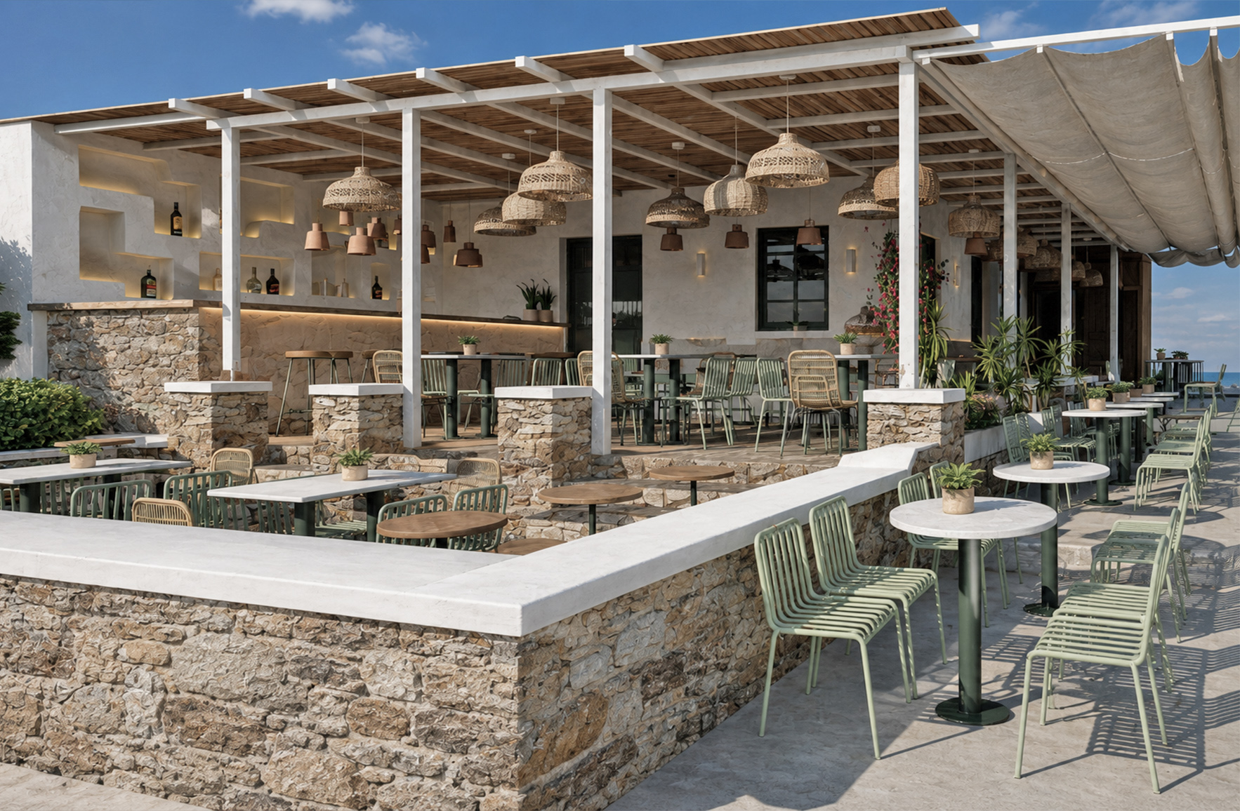 Outdoor courtyard of Tanit Restaurant in Mykonos with a wooden pergola, stone-built terraces, and multiple seating areas.